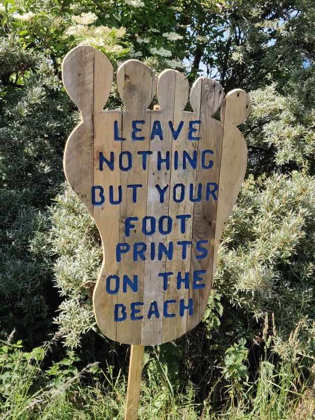 Footprint shaped sign at Gullane Bents